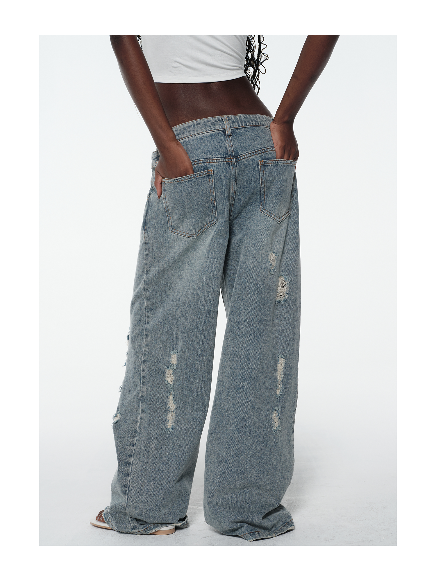 KIMUSSO Layered-Waist Distressed Denim Trousers with a Straight-Leg Silhouette